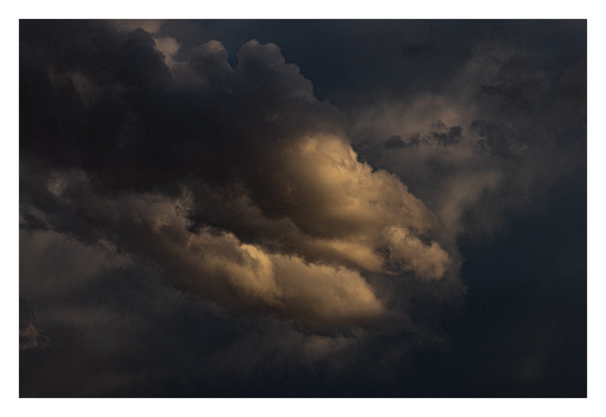Dense Alberta cloud, close and weighted. Shown with the white signing border.