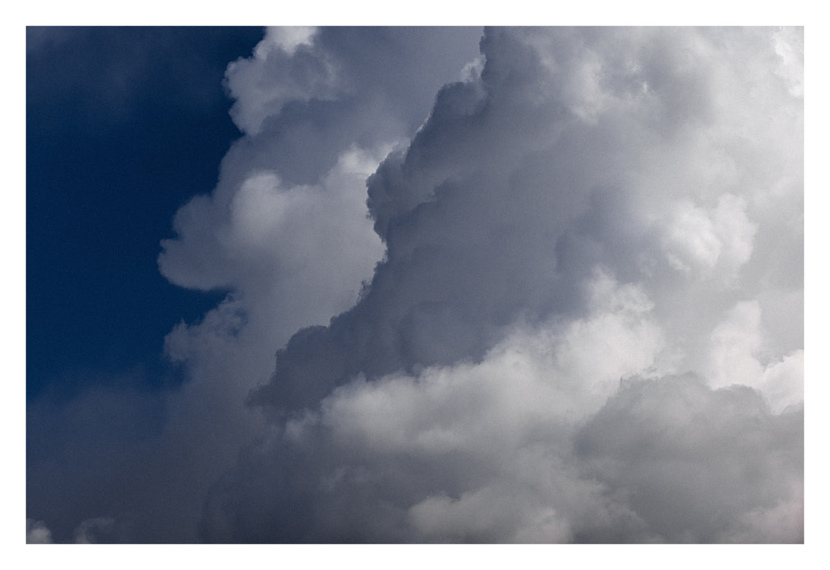 A purposeful Alberta sky of weight, shadow and presence. Shown with the white signing border.