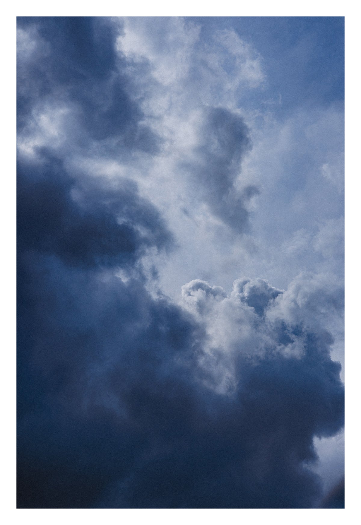 An Alberta sky suspended between two infinities, ocean and cloud. Shown with the white signing border.