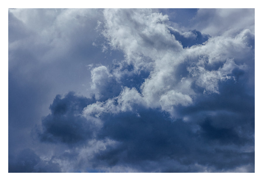 Enveloping blue-grey Alberta cloud, deep and still. Shown with the white signing border.