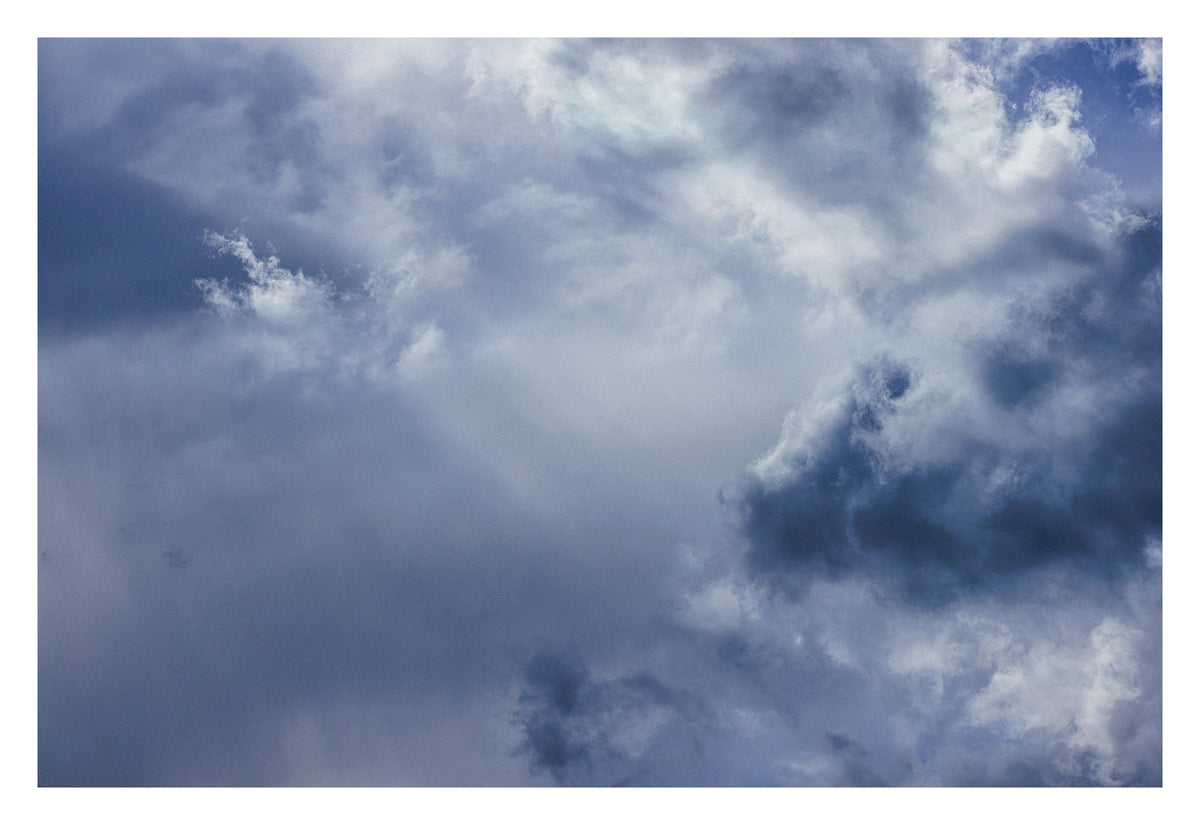 Vast Alberta cloud suspended between above and below. Shown with the white signing border.
