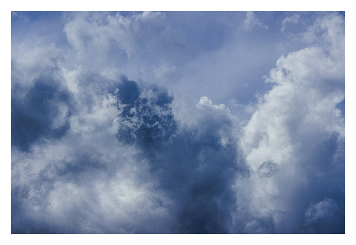 An Alberta sky held between two infinities. Shown with the white signing border.