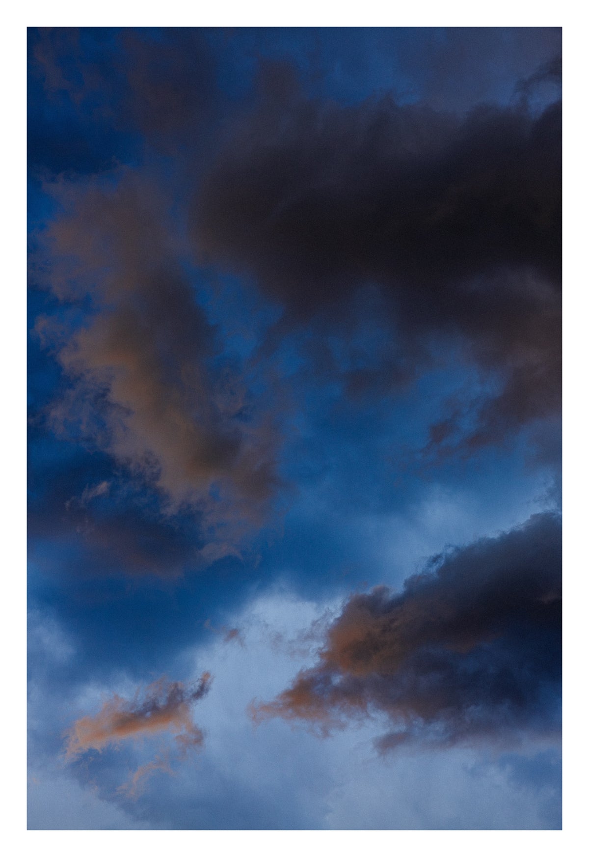 An Alberta sky in the breath before the weather exhales. Shown with the white signing border.