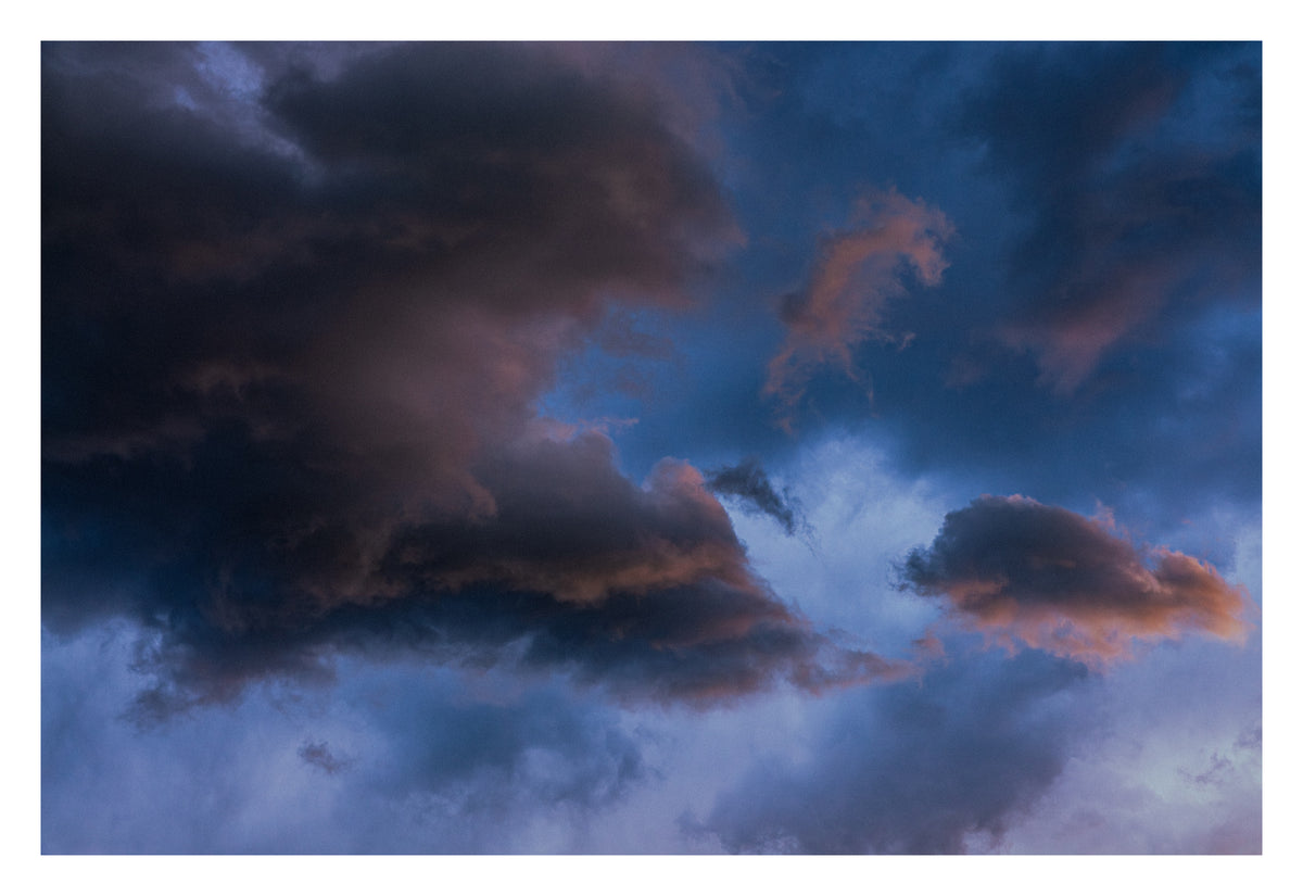 Light breaking as revelation through an Alberta cloud. Shown with the white signing border.