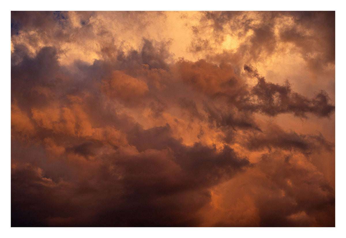 Soft Alberta cloud — the approach before the arrival. Shown with the white signing border.