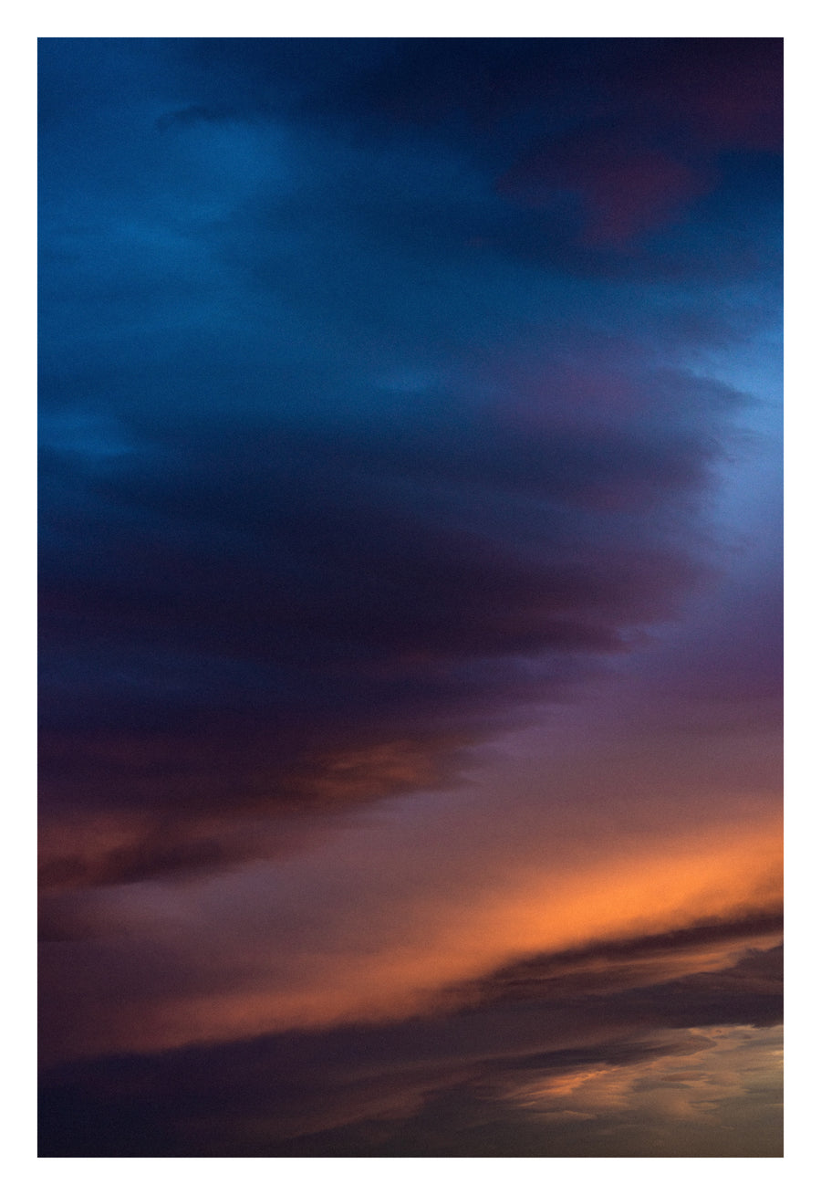 An immense, saturated Alberta sunset. Shown with the white signing border.