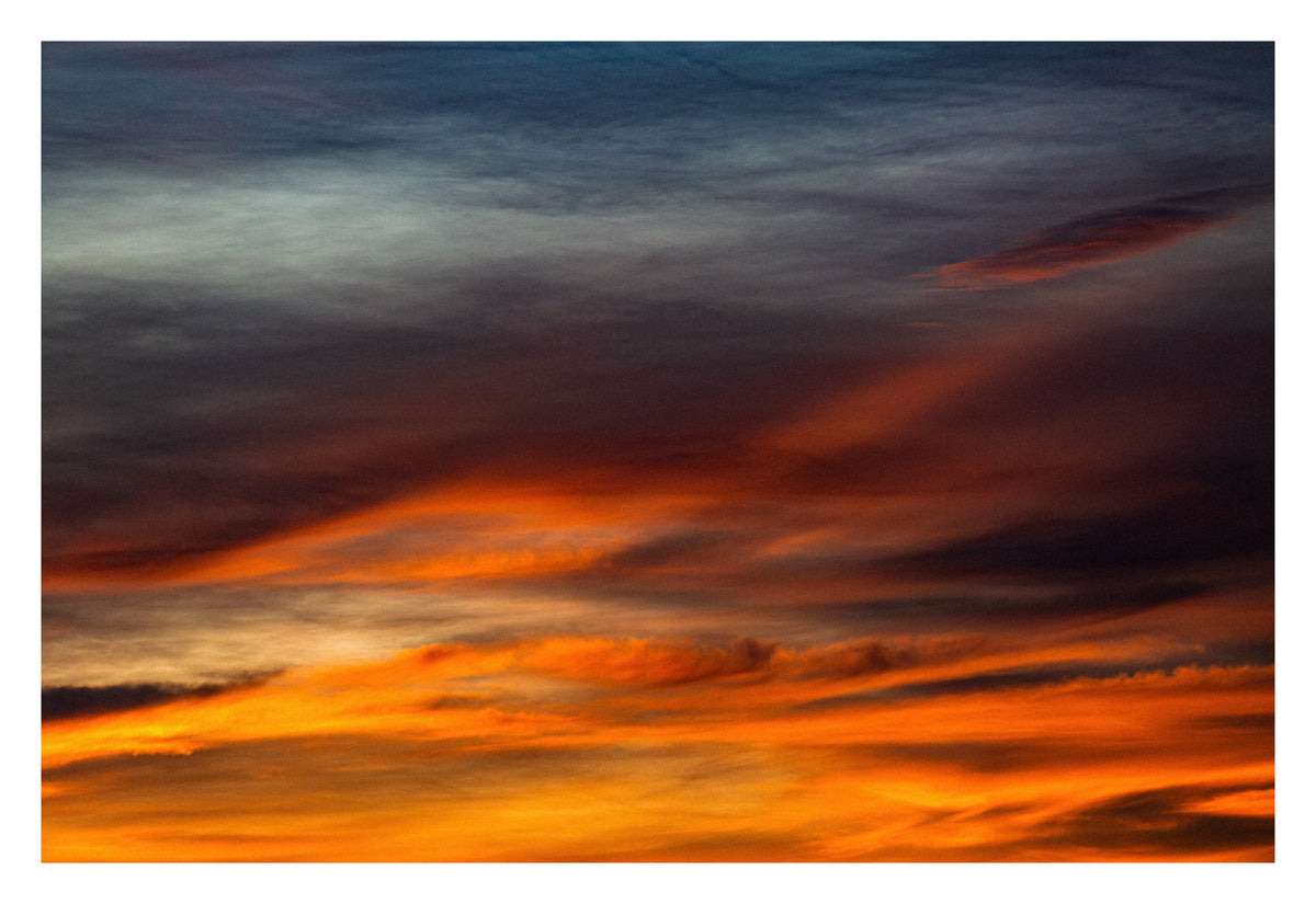 Textured Alberta cloud at golden hour, the light almost touchable. Shown with the white signing border.