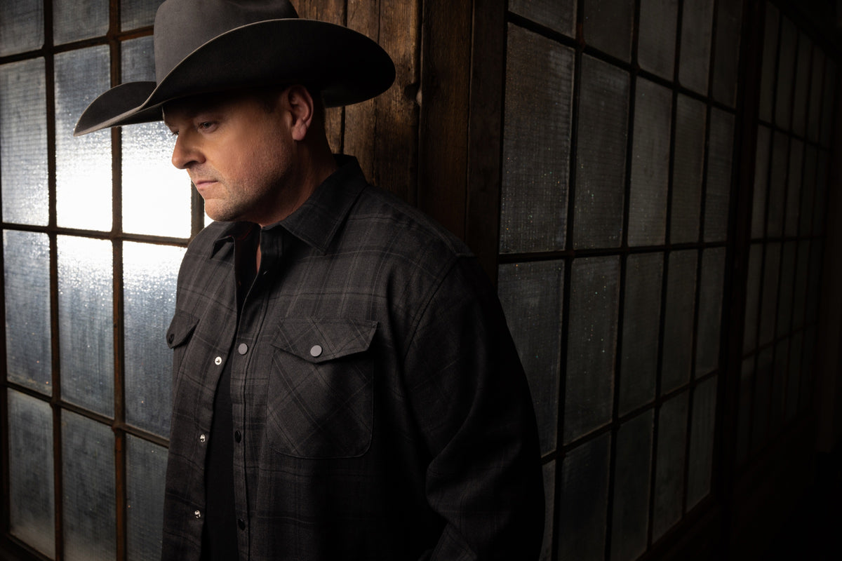 Gord Bamford by a window in low light, photographed by Phil Crozier